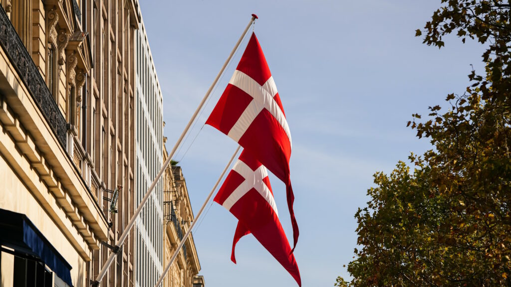 Flag of Denmark floating on a building