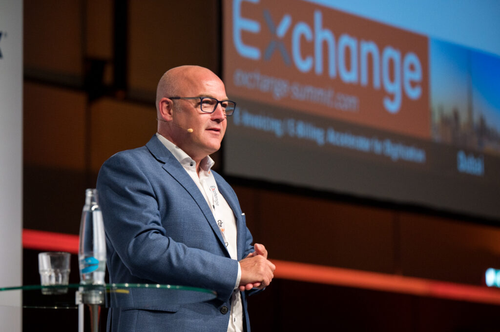 Photo of Johannes von Mulert on stage at the Exchange Summit 2024 Prague